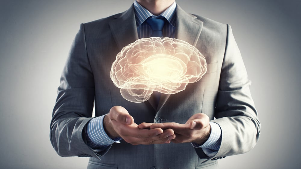 Close up of businessman holding digital image of brain in palm-3