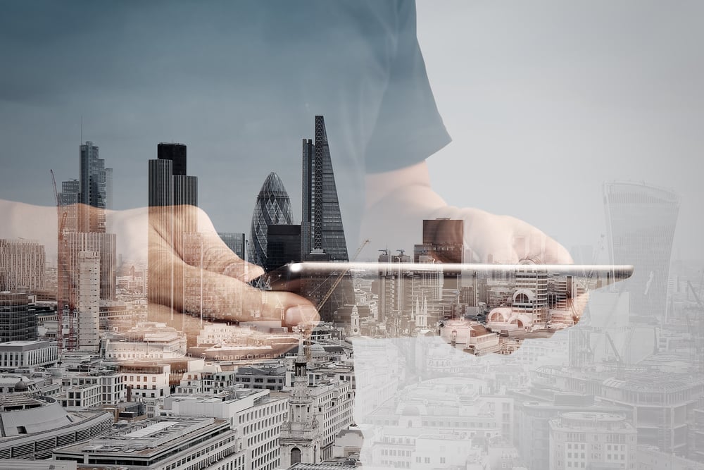 Double exposure of success businessman using digital tablet with london building and social media diagram-3