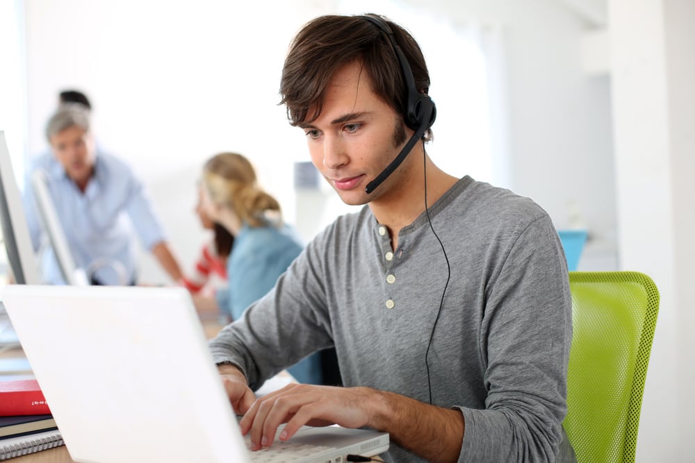 Student with headset on doing English language test-1