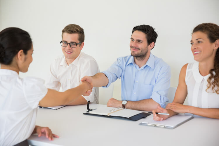 Business people shaking hands during job recruitment meeting in office